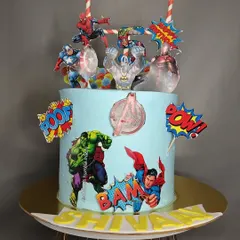 An action-packed Avengers theme cake for a young superhero fan. This cake brings together Iron Man, Captain America, Hulk, and Spider-Man for an epic birthday battle.