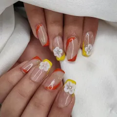 A full view of the colorful French manicure with hand-sculpted 3D flowers, a perfect design for spring or summer.