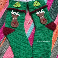 Getting into the festive spirit with our handmade Christmas stockings. This pair features a cute reindeer and a little Christmas tree, all crocheted with care.