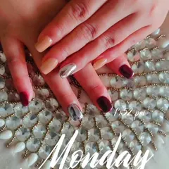 A different view of the maroon, nude, and silver chrome nail art combination.