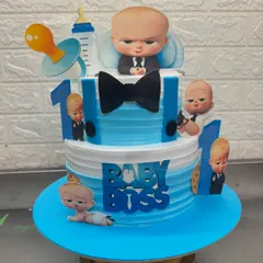 The Boss Baby is a super popular theme for first birthdays. For this two-tier cake, I used sharp blue and white colors and multiple character cutouts to create a fun and impressive centerpiece for the little boss's big day.