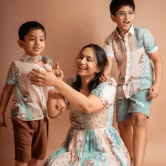 A mother's love is a beautiful thing to witness. This candid moment captures the joy and connection between a mom and her two boys.