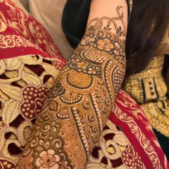 A side view showing the detail on the arm, including a delicate snake motif and other unique elements requested by the bride.