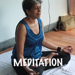 Meditation is the path to peace of mind. Here I am in a simple cross-legged position, showing that meditation is accessible to everyone.