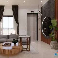 A beautifully lit living area in a villa, showcasing a custom-designed wall partition next to the elevator. The space features a comfortable L-shaped sofa and a modern coffee table, perfect for family gatherings.