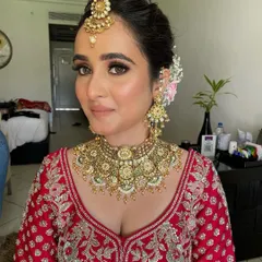 A stunning bridal portrait. I created a classic look with smokey eyes, flawless skin, and a neutral lip to complement her heavy gold jewelry.
