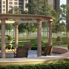 A Roman-inspired pavilion at Casagrand Sun City, complete with classical columns and a central fire pit, designed for evening gatherings and social events.