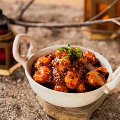 A beautifully styled shot of the Tamarind Potatoes. This dish is a unique vegetarian appetizer that always gets rave reviews from guests.