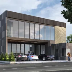 This office for a realtor features a clean, modern design with extensive use of glass to create a transparent and welcoming feel. The facade combines dark panels with a textured stone-like accent, giving the building a sophisticated and professional look.