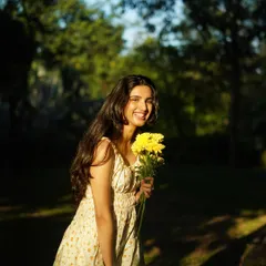 A bright, happy smile is the best accessory. This is a perfect example of a relaxed and natural outdoor portrait.