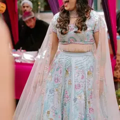 The bride's joyous laughter captured mid-dance at her Sangeet. We create the atmosphere, so you can create the memories.