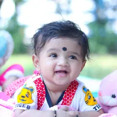 The purest happy smile from a baby milestone session. My focus is on bright, colorful photography that highlights your baby's joyful spirit.