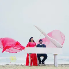Creating unique concepts for pre-wedding shoots is part of the service. Here, the couple I styled poses with a piano on the beach, with her pink gown adding a pop of colour.