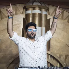 Hands up, energy up. This is me in my element, connecting with the crowd and making sure every single person feels the music. If you're not jumping, I'm not doing my job right.