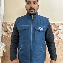 This is a straight-on view of the blue trainer vest. The K9 logo shows your professional commitment, and the zippered front keeps everything secure, whether you're running, bending, or working a dog.