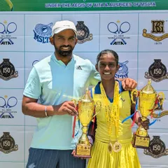 A coach and his champion. I am pictured here with Trisha Bhosale and her two trophies from the National Series, celebrating a perfect tournament week.