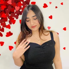 Modeling the GIVA necklace with a simple black dress. I show how a single piece of jewelry can elevate a whole look, making it a versatile accessory.