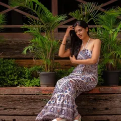 The bohemian-print jumpsuit and the urban garden setting come together for a chic and breezy lifestyle portrait. This is a great look for a relaxed afternoon shoot.