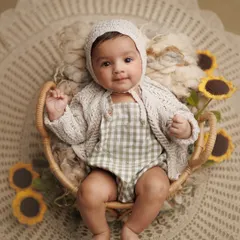 This was my own son Caden at 3.5 months old, surrounded by sunflowers. I love documenting every stage, creating at least one special setup each month to watch him grow.