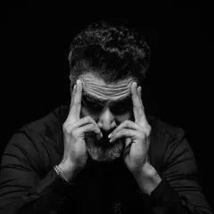 Here, the focus shifts to a moment of intense concentration. The lighting is carefully controlled to highlight the texture of his skin and the gravity of his pose, making for a powerful character portrait.