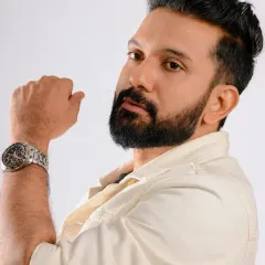 A stylish portrait of Ankith Madhav. The grooming here was about creating a sharp, defined look that highlighted his features for a strong and confident photograph.