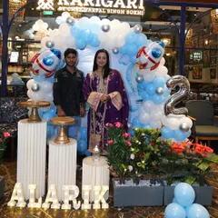 A photo of my team member with actress Sanjjanaa Galrani at her son's birthday party. We are proud to deliver professional service and beautiful results for all our clients.