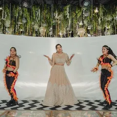 The bride takes center stage with her backup dancers for a stunning Sangeet performance. My photography captures the movement and glamour of these choreographed moments.