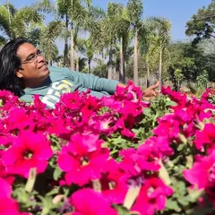 There is no greater joy for me than being surrounded by flowers. Here I am, lost in a sea of bright pink petunias.