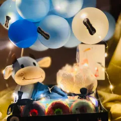 The same baby boy hamper illuminated with fairy lights. This adds a magical glow and makes the gift feel extra special, especially when given in the evening.