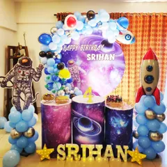 An out-of-this-world space theme for Srihan's 4th birthday. I used a galaxy-print backdrop, astronaut and rocket cutouts, and planet-themed cake stands to create an immersive cosmic adventure for the little explorer.