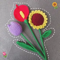 A vibrant trio of my crochet flowers: a purple tulip, a red casa lily, and a classic sunflower. You can mix and match to create your own custom bouquet.
