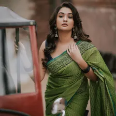 We can find beauty anywhere. This outdoor fashion shoot combines a traditional green saree with a rustic auto-rickshaw, creating a unique contrast. It shows how we can blend modern Indian fashion with everyday elements for a memorable portrait.