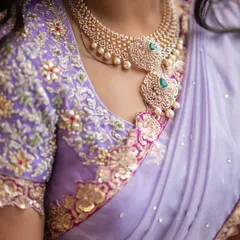 The magic is in the details. This is a close-up of a hand-embroidered blouse for a lilac Langa Dhavani, featuring delicate zardosi, beadwork, and floral motifs that bring the entire outfit to life. I believe the blouse is the heart of the ensemble.