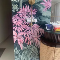 The lower section of the mural demonstrates the flow of the composition. We use layers of leaves and varying shades of green and pink to create a realistic sense of depth.