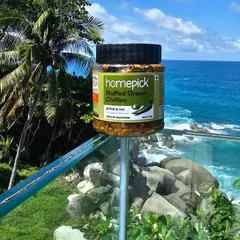 A jar of our Stuffed Green Chillies enjoying a scenic view. It's proof that a good pickle can make any moment, and any location, feel a little more like home.