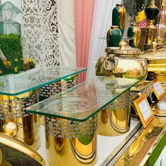 A beautiful outdoor buffet setup featuring polished brass chafing dishes and intricate decor. I use high-quality equipment and thoughtful design elements to ensure my catering stations enhance the overall aesthetic of the event.
