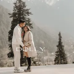 A serene pre-wedding portrait in Gulmarg, Kashmir, with the majestic snow-capped mountains providing a breathtaking backdrop.