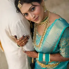 An intimate couple portrait. The bride looks stunning, and her traditional look is a beautiful contrast to the groom's simple white attire.