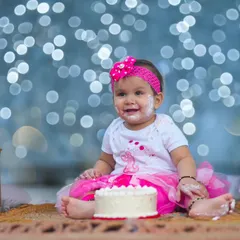 The pure, messy joy of a first birthday cake smash. These sessions are all about fun and capturing your baby's delightful reactions. I love the genuine smiles and frosting-covered fingers that make these photos so special.