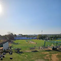 Our academy in Gurgaon is a complete ecosystem for a cricketer's development. This wide view shows our expansive grounds, multiple nets, and practice wickets, providing a professional environment where players can focus entirely on their game, away from distractions.
