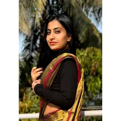 Launching 'Aarini', our Ugadi Edit. This tissue cotton saree in a unique copper-brown shade is styled here with a turtleneck, showing its versatility.