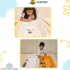 This sensory station combines multiple activities. One child uses tongs to move pom-poms, developing pincer grasp, while another explores blowing objects across the water, learning about air and movement.