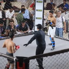 One of our experienced fighters, Vinod Kumar, prepares for an exchange during the Bengaluru Open MMA Championship. This event tests the full range of skills learned, from striking to grappling.