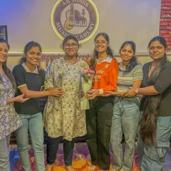 Our adult students are a huge part of our musical family. Here they are celebrating a birthday with flowers and smiles after our class session.