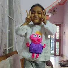 A happy customer in her custom-made Peppa Pig sweater. I love making fun, character-themed apparel for kids.