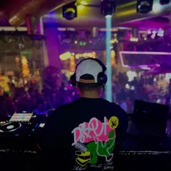 Fuel to your fire. A shot from behind the console, looking out at a packed venue. My mission is to ignite the dance floor.