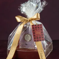 This Diwali hamper is a perfect gesture of love, featuring our handmade assorted dry fruit chocolates and a beautiful scented candle, all wrapped up for the occasion.