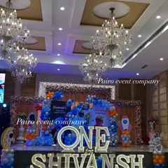 For this first birthday, we went all out with a 'Space Theme' in a large banquet hall. I used large, illuminated letters for the birthday boy's name and age, a detailed backdrop showing his 'First Trip Around The Sun', and extensive balloon work to create a galaxy of fun.