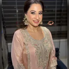 A beautiful client ready for her Roka. Her hair is styled in a sophisticated half-updo that perfectly complements her traditional outfit.