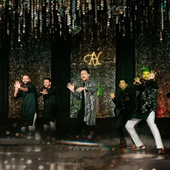The groom and his backup dancers in a high-energy moment from his solo performance. We love creating these dynamic, synchronized routines that look amazing on stage.